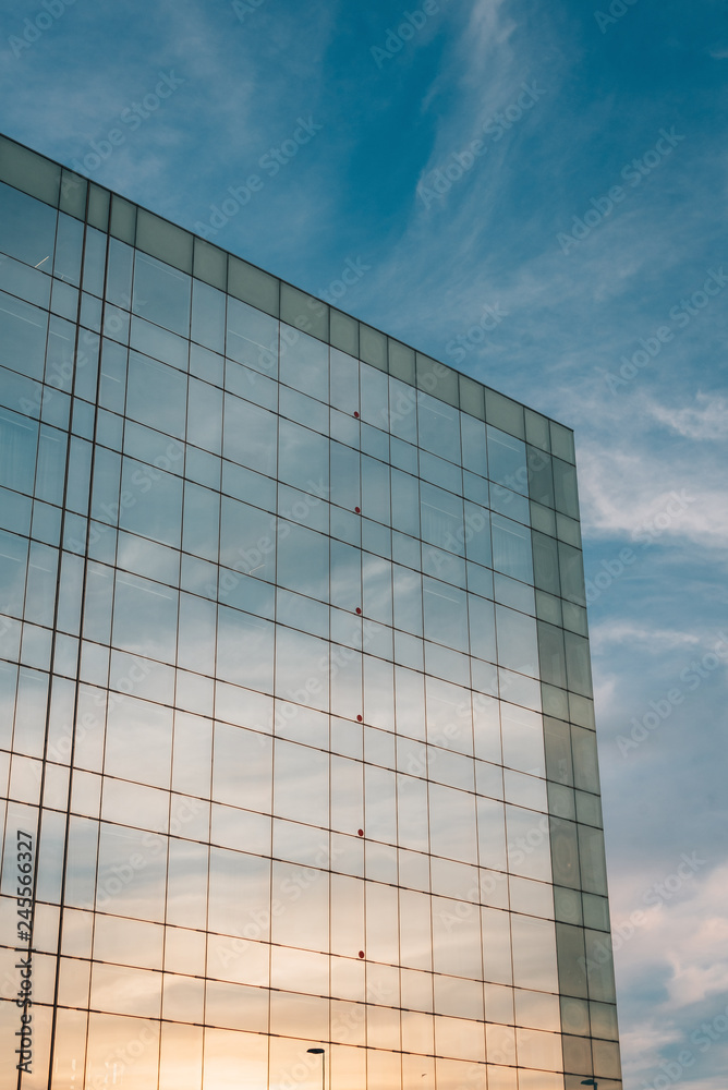 Modern glass building reflects a sunset, in Barcelona, Spain Modern glass building reflects a sunset, in Barcelona, Spain
