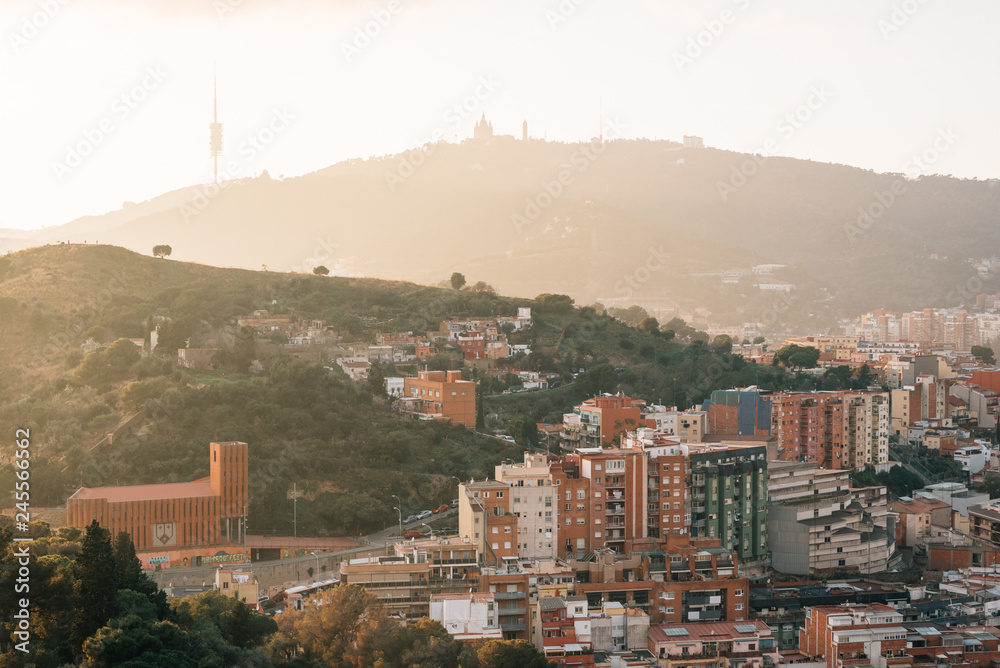 Fototapeta premium Sunset view of mountains from Bunkers del Carmel, in Barcelona, Spain