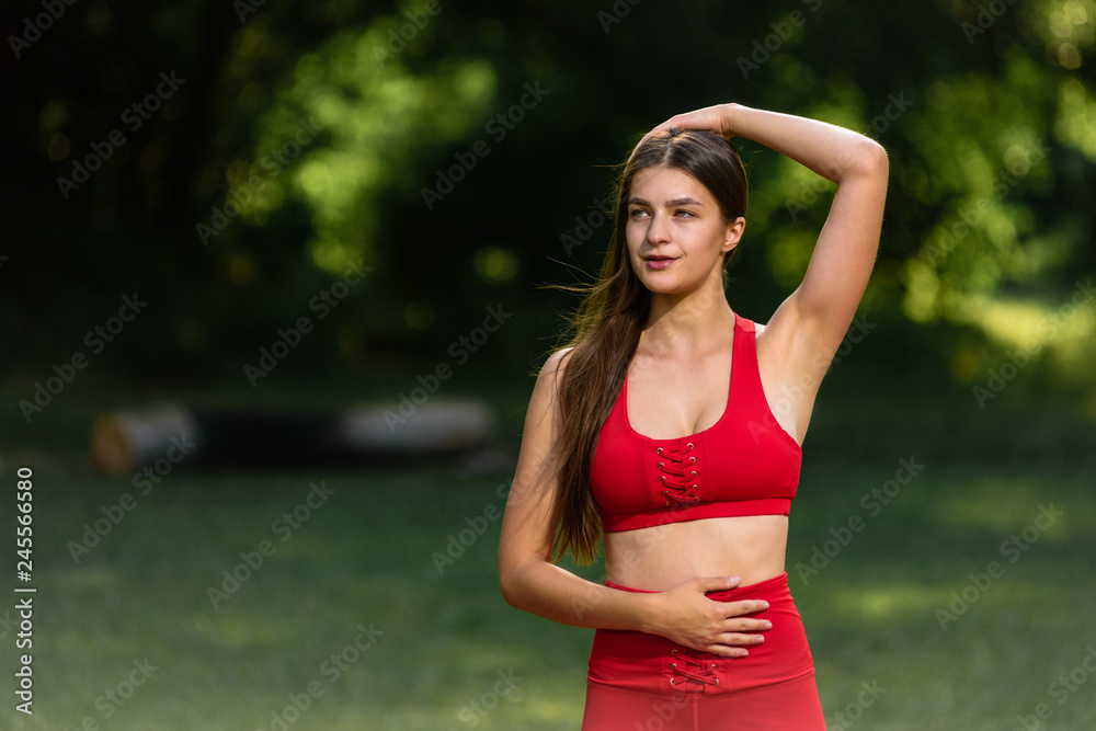 Portrait of slim woman with perfect body stretching outdoor Portrait of slim woman with perfect body stretching outdoor