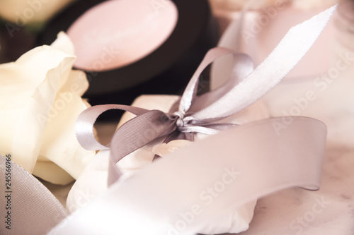 cosmetics  rose  sea salt  coconut oil  gray ribbon  white wax  gift with bow