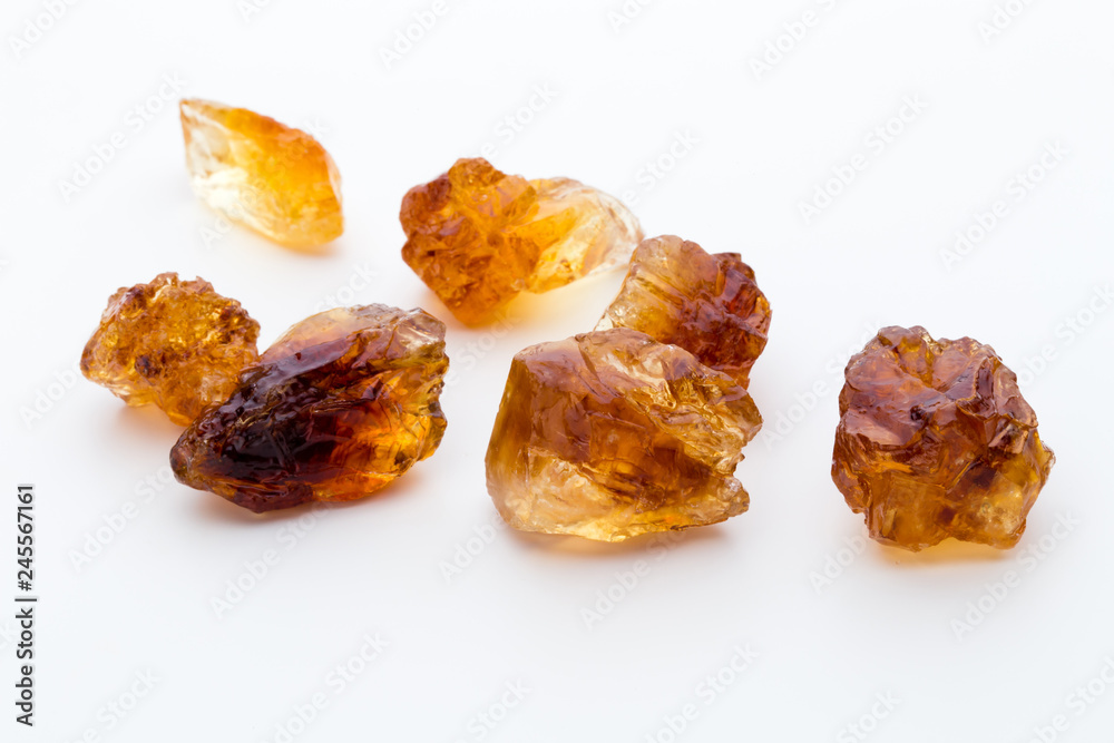 Brown caramelized sugar on white background. Brown caramelized sugar on white background.