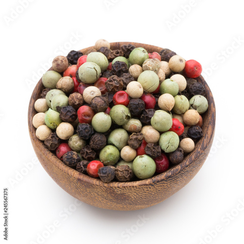 Pepper mix seed on spoon on white background.