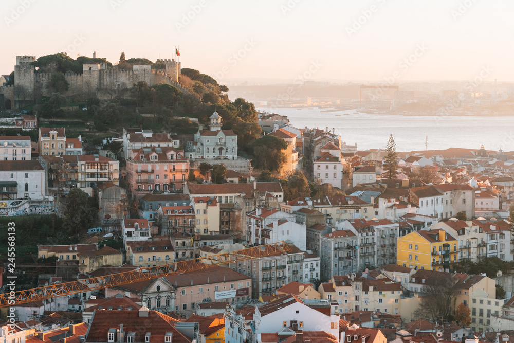 View of the Castelo de Sao Jorge and Alfama at sunset, in Lisbon, Portugal