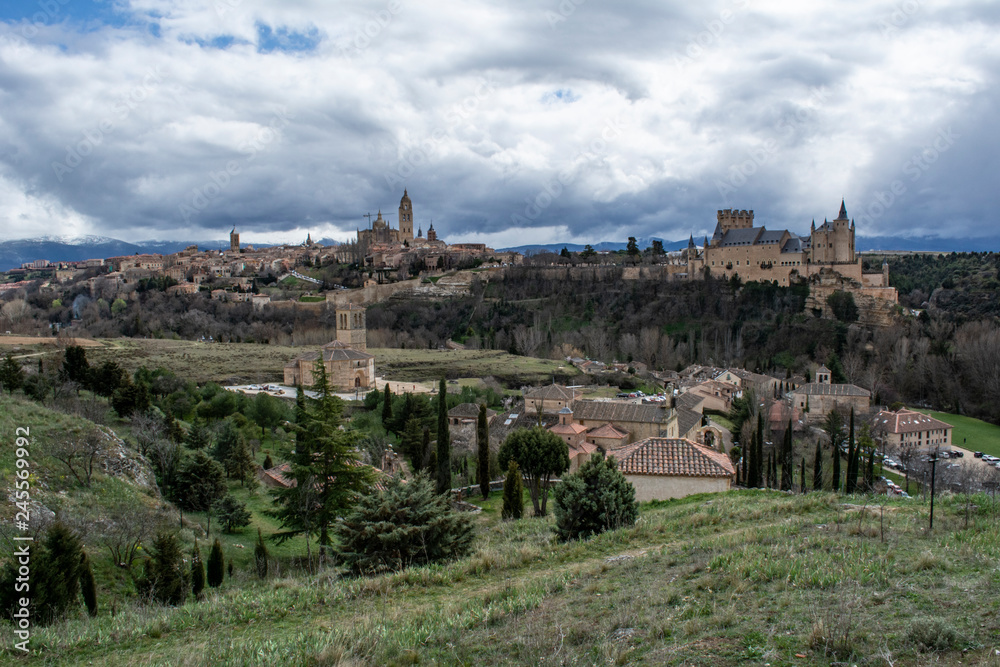 View over the town with its cathedral  and medieval walls in Segovia