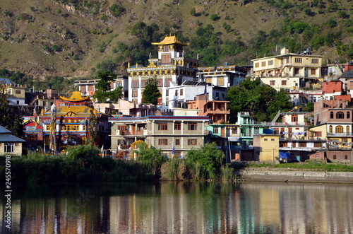 View on sacred Rewalsar lake and Tibetian monastery in holy buddhist Rewalsar city, India photo