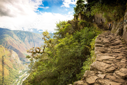 Inca path walking on the edge towards Machu Picchu