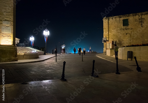 Walking through the night Malta. Maltese style in the light of night lanterns.