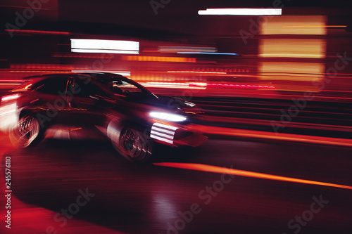 Motion blurry car abstract car driving by at night. Köln, Cologne in Germany © Ricardo