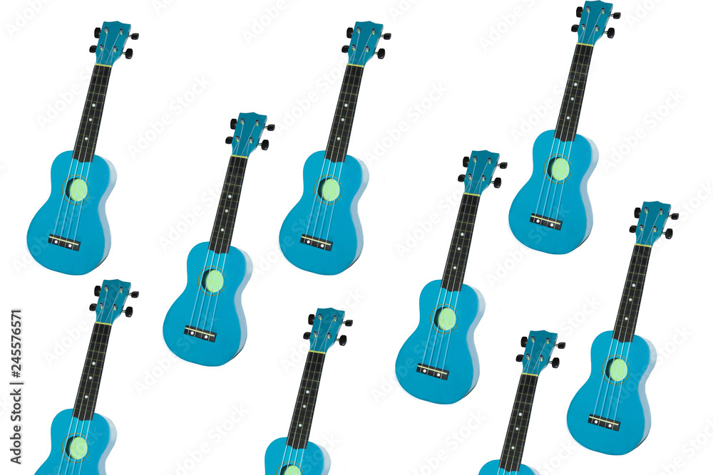Naklejka premium blue ukulele on white background. small guitar isolate