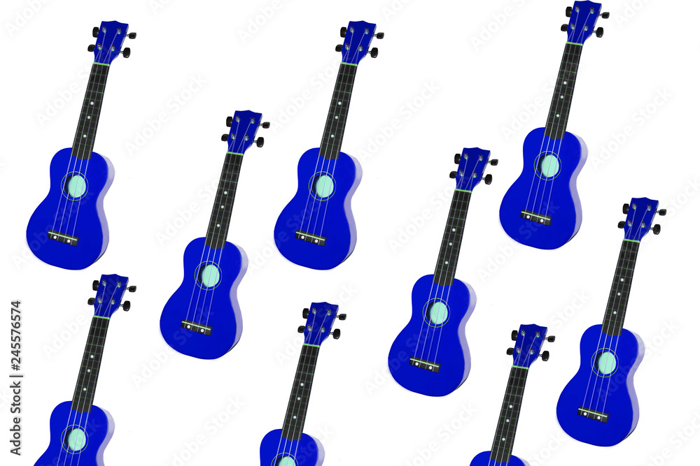 Naklejka premium blue ukulele on white background. small guitar isolate