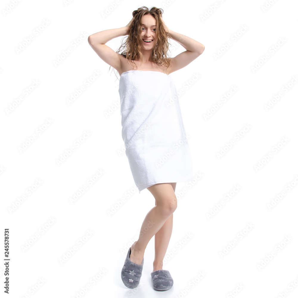 Beautiful woman in white towel and slippers beauty body care on white background isolation Beautiful woman in white towel and slippers beauty body care on white background isolation