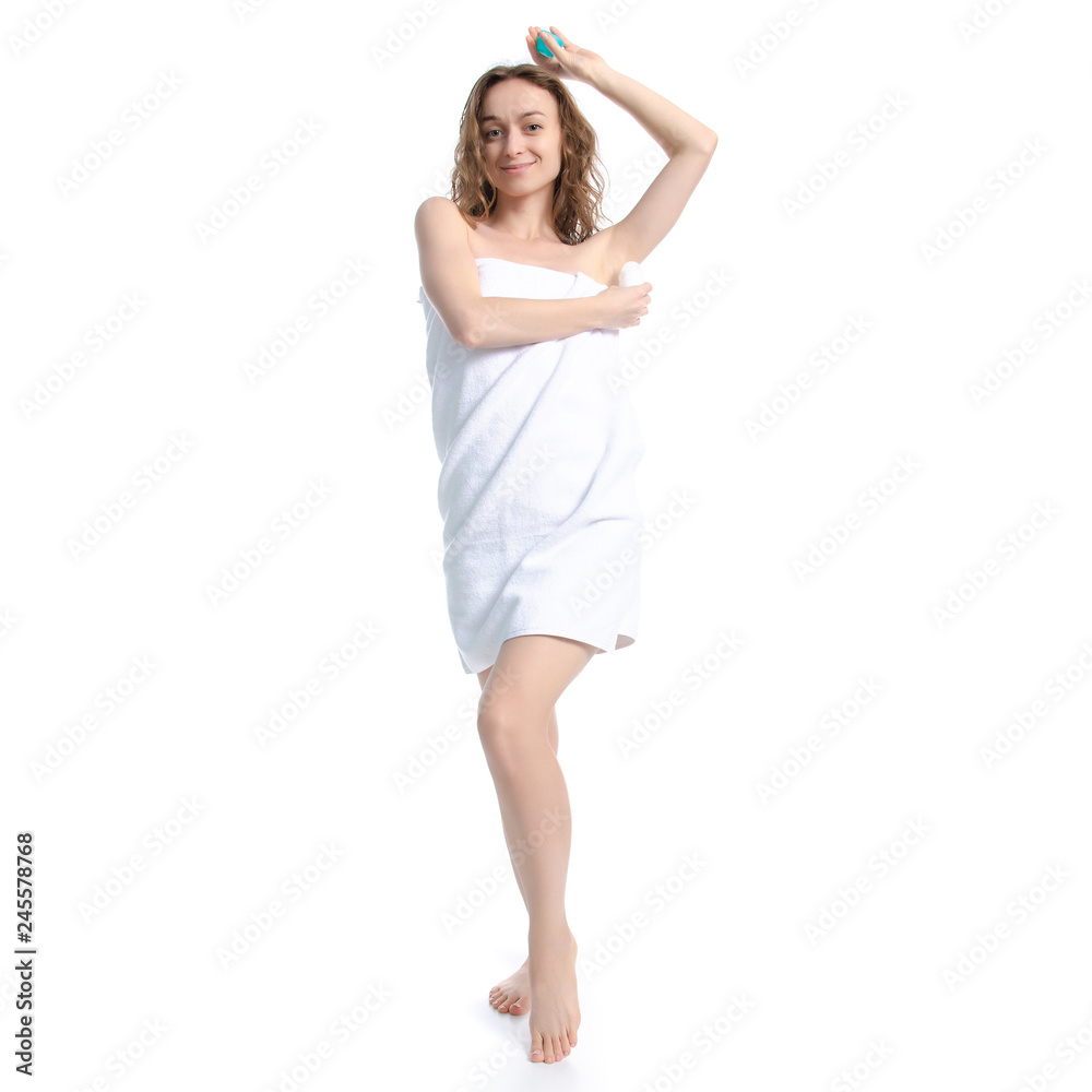 Beautiful woman in white towel roller antiperspirant in hand beauty body care on white background isolation Beautiful woman in white towel roller antiperspirant in hand beauty body care on white background isolation