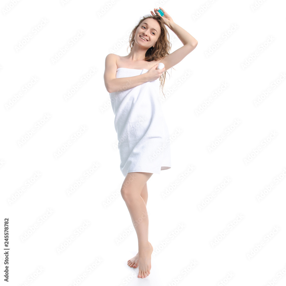 Beautiful woman in white towel roller antiperspirant in hand beauty body care on white background isolation Beautiful woman in white towel roller antiperspirant in hand beauty body care on white background isolation