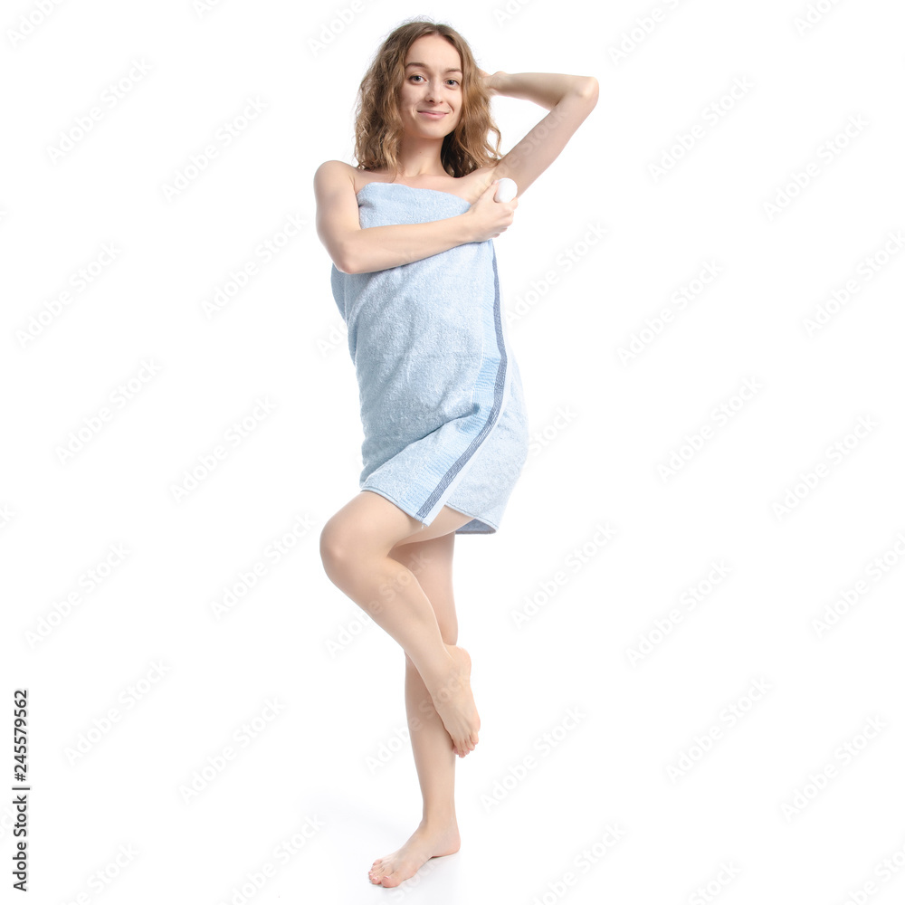 Beautiful woman in blue towel roller antiperspirant in hand beauty body care on white background isolation Beautiful woman in blue towel roller antiperspirant in hand beauty body care on white background isolation