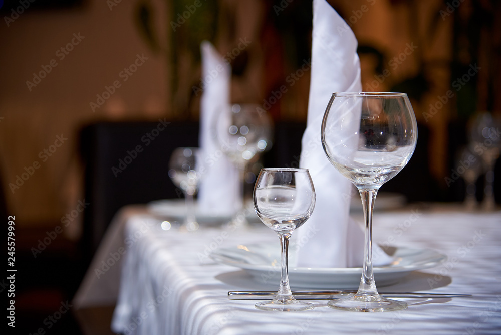 Empty wine glass on the banquet table.Table setting for a banquet or dinner party.