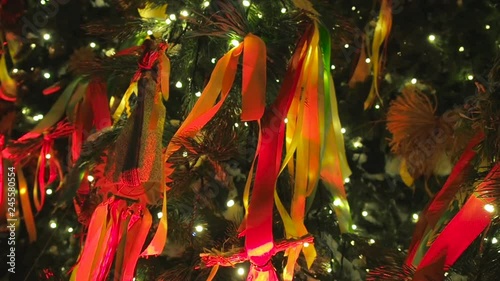 Decorated Christmas trees in honor of the Shrovetide week in Moscow near the Red Square. Beautiful scenery from colored ribbons, bagels, and rag dolls photo