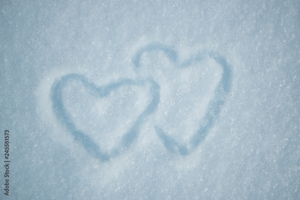 drawing of two heart on snow drawing of two heart on snow