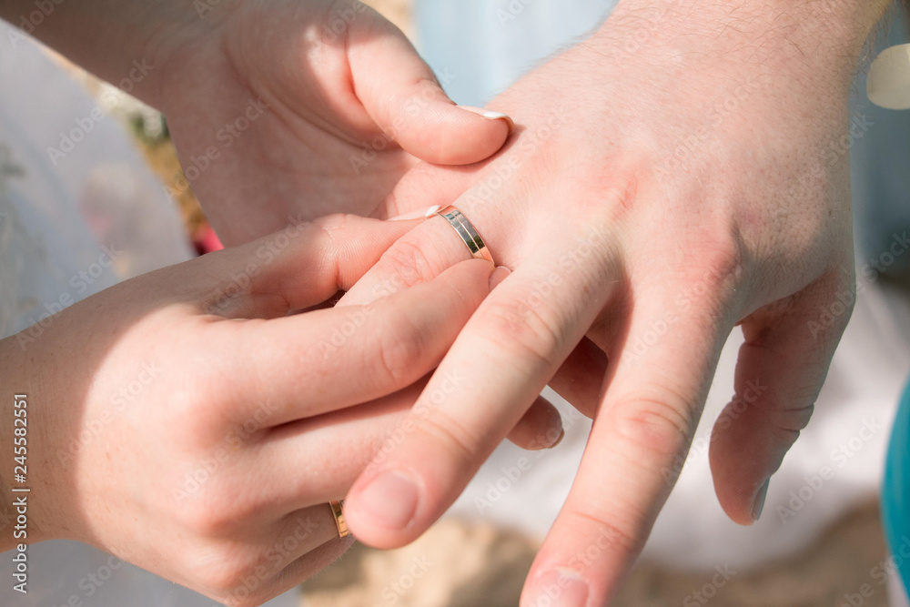 Newlyweds wear rings. Hands newlyweds. Newlyweds wear rings. Hands newlyweds.
