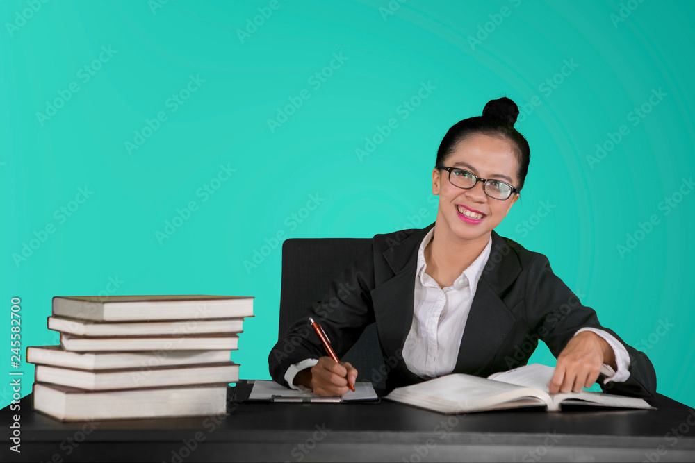 Happy businesswoman overworking in the studio Happy businesswoman overworking in the studio