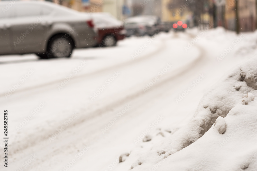 Car on winter road covered with snow. Vehicle at snowfall