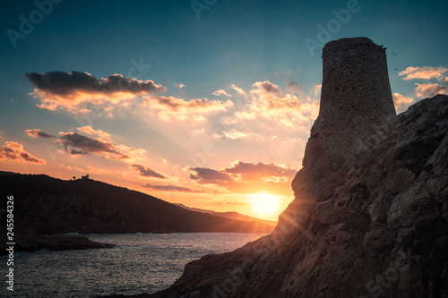 Sune setting behind Genoese Tower at Ile Rouse in Corsica photo
