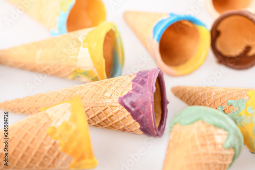 Glazed ice cream cones on a white background