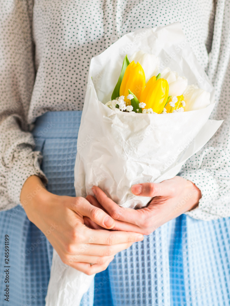 Woman holding bouquet of tulips. Woman's day Woman holding bouquet of tulips. Woman's day