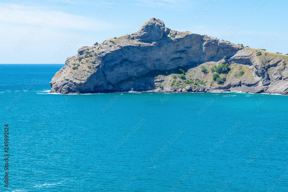 Calm turquoise azure sea in the Blue Bay. Beautiful scenery on the coast of Cape Kapchik in the Crimea, so close.