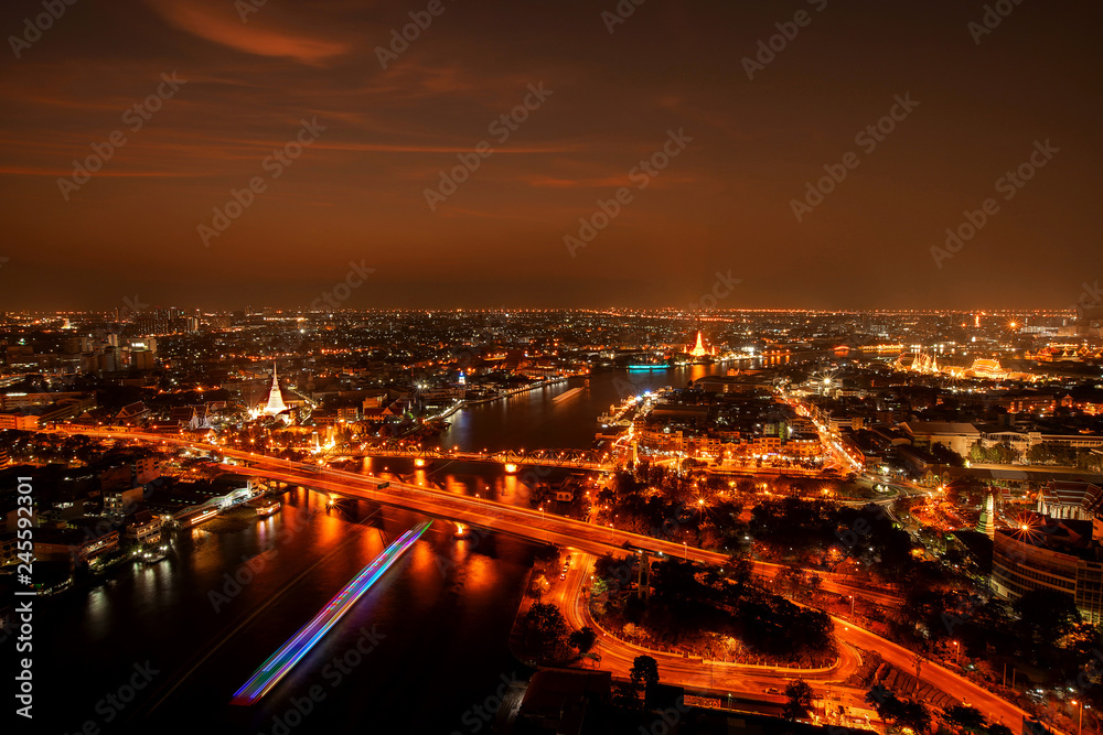 City Scape, Panorama of Chao Praya River. River view overlooking the Phra Phuttha Yodfa Bridge, Memorial Bridge and Wat Arun with grand Palace in the background, Bangkok Thailand. 26 January 2019