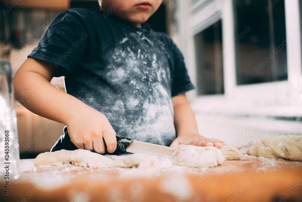 The child makes dough dumplings or dumplings is fun with enthusiasm The child makes dough dumplings or dumplings is fun with enthusiasm