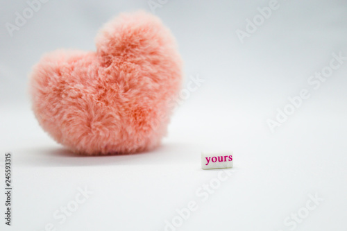Pink heart on the white background