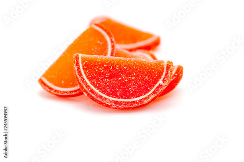 Citrus jelly slices in sugar on white background