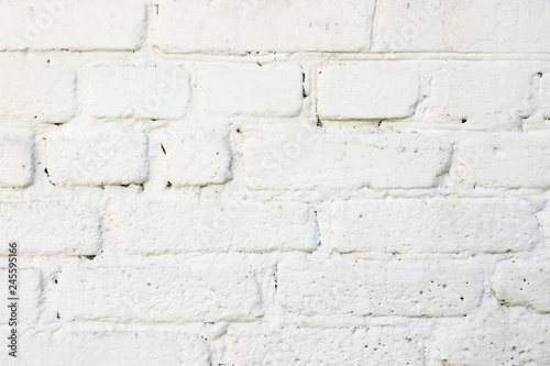 Texture of white painted brick wall. Close-up. Grunge background with space for text or image. Empty template and mockup for designers.