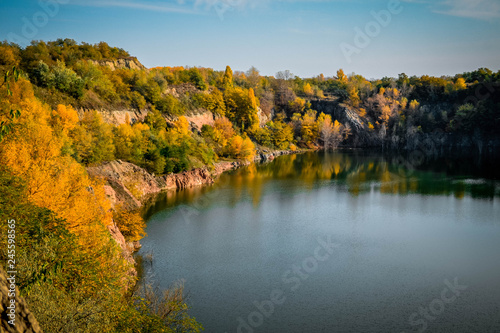 Old flooded quarry in autumn © Ruslan