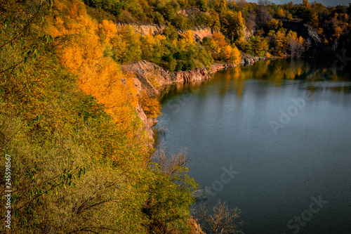 Fototapeta Naklejka Na Ścianę i Meble -  Old flooded quarry in autumn