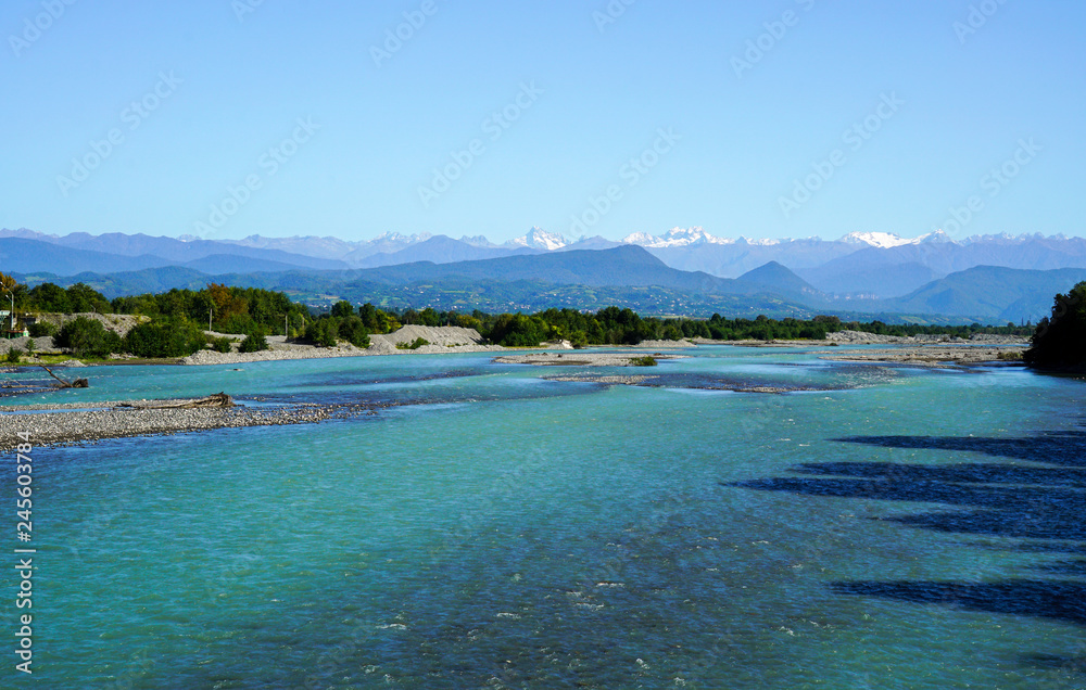 View from the bed of the Kodor river to the mountain peaks of the great Caucasus mountain range covered with snow. View from the bed of the Kodor river to the mountain peaks of the great Caucasus mountain range covered with snow.