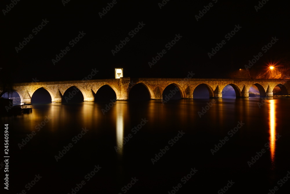 View of the famous bridge in Visegrad (Bosnia and Herzegovina) at night. View of the famous bridge in Visegrad (Bosnia and Herzegovina) at night.