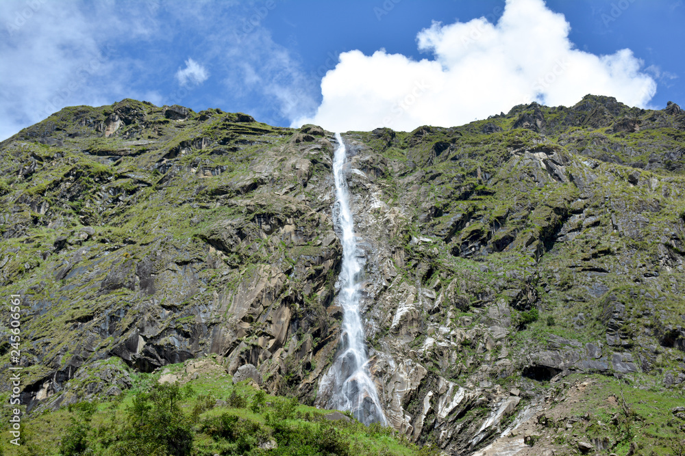 Beautiful view of the waterfall on the way to Amjilosa village. Trek to Kangchenjunga, Great Himalaya Trail, Nepal.