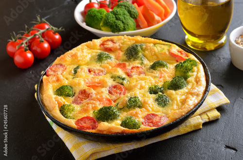 Omelet with herbs, broccoli and fresh tomatoes