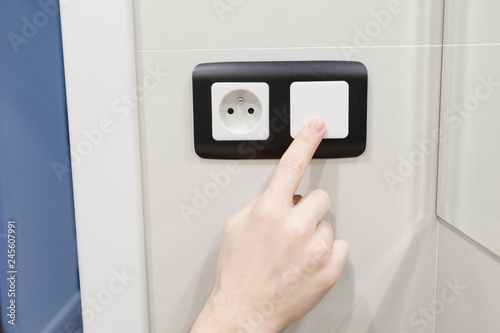Turn off light switch close up. Electric socket with power plug