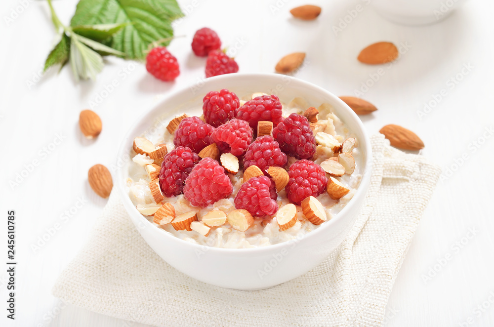 Tasty oatmeal porridge with raspberries and nuts Tasty oatmeal porridge with raspberries and nuts