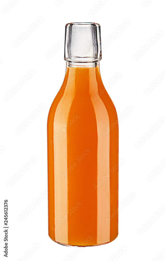 Glass bottle of carrot juice isolated on white background. Glass bottle of carrot juice isolated on white background.