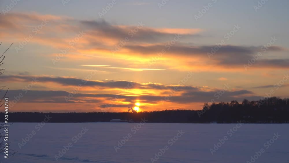 View of the winter forest and frozen lake covered with snow, dolly shot