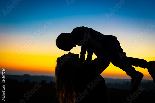 silhouette of a mother and son