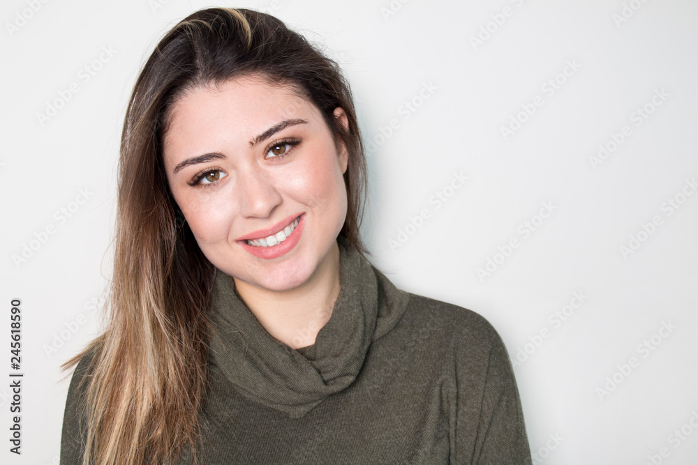 Portrait of young beautiful cute cheerful girl smiling looking at camera over white background. Portrait of young beautiful cute cheerful girl smiling looking at camera over white background.