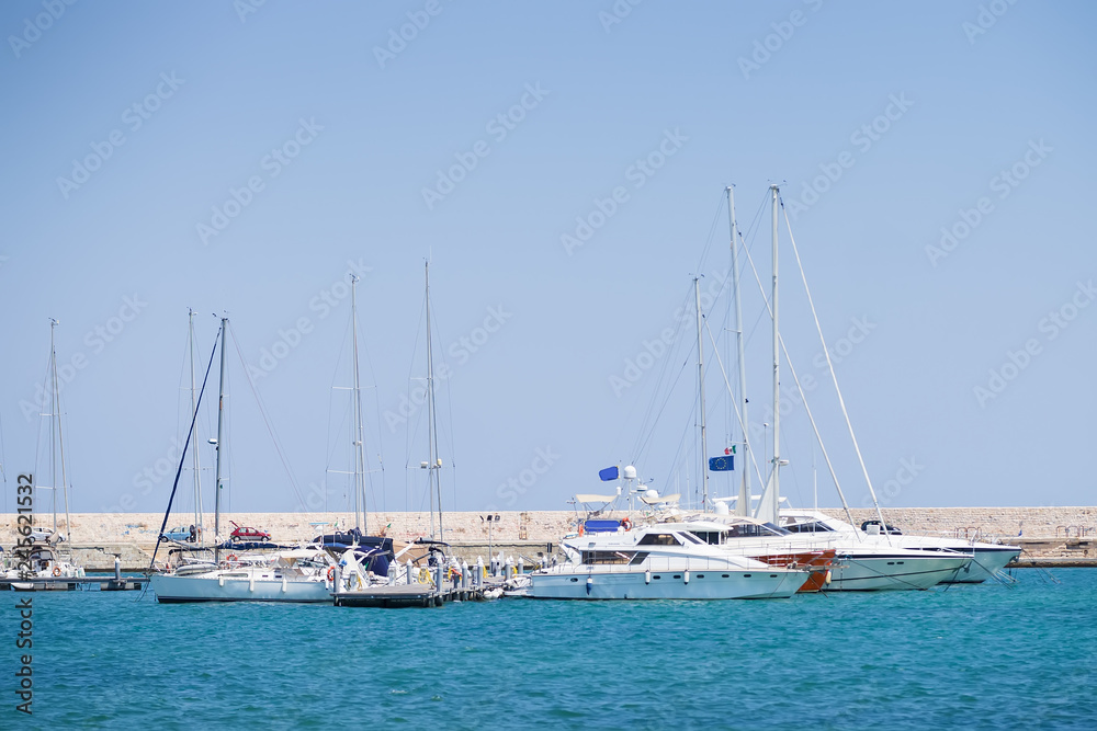 BARI, ITALY - JULY 11,2018, Fyachts and boats in the port of Bari, sunny summer day, Apulia