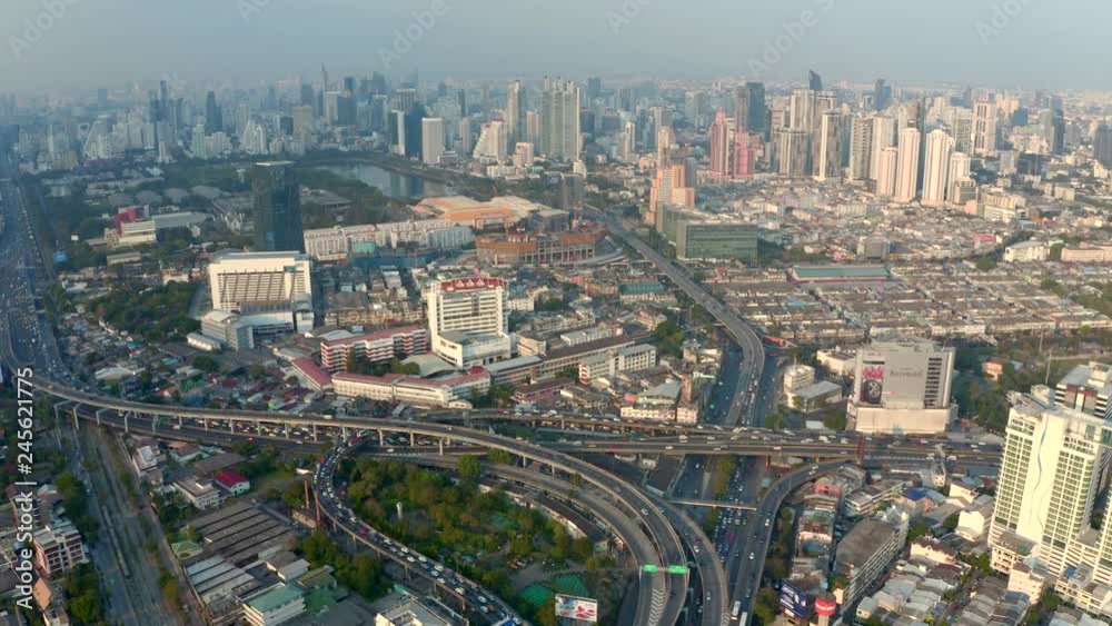 Bangkok central business downtown, heavy traffic aerial view. Top view of Thailand's capital. Big city life, transportation, infrustructure and developing country concept. Bangkok central business downtown, heavy traffic aerial view. Top view of Thailand's capital. Big city life, transportation, infrustructure and developing country concept.