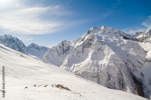 Smooth ski slopes of the Caucasus Mountains on a sunny winter day