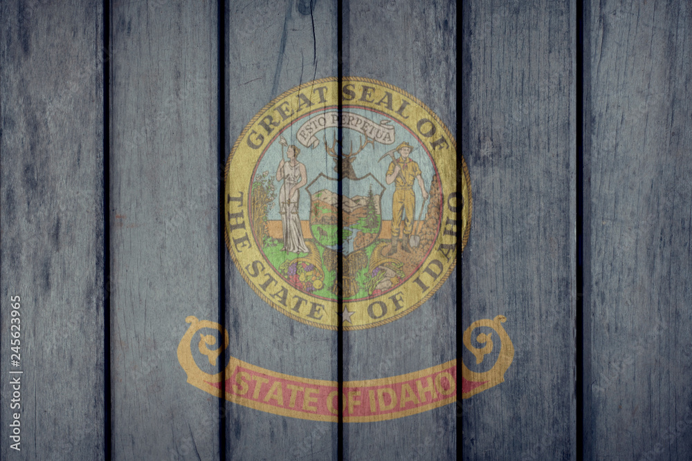 USA Politics News Concept: US State Idaho Flag Wooden Fence