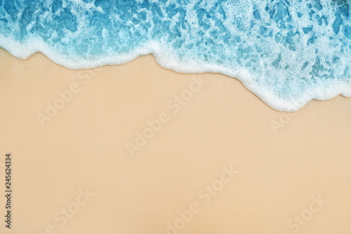 Background of Soft Blue Ocean Wave On Sandy Tropical Beach. photo